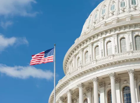 Close-up - The U.S. Capitol Building with American Flag - Daylight