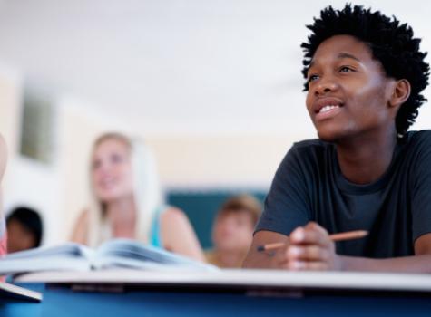 Close-up Black Male Student Focused in Class