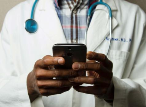 Close-up - Black Male Hands - Doctor - Holding Cell Phone