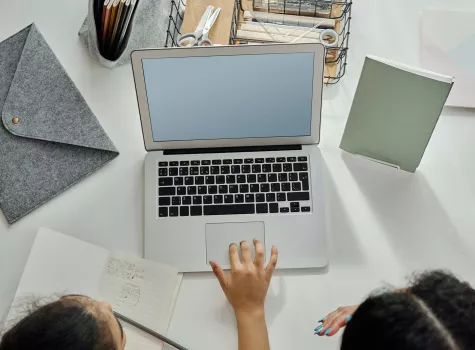 Female and Young Child working together on laptop