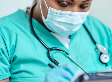 Black Female Nurse - in face mask