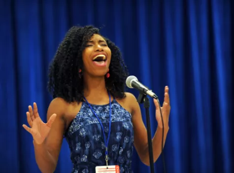 Girl singing in ACT-SO competition