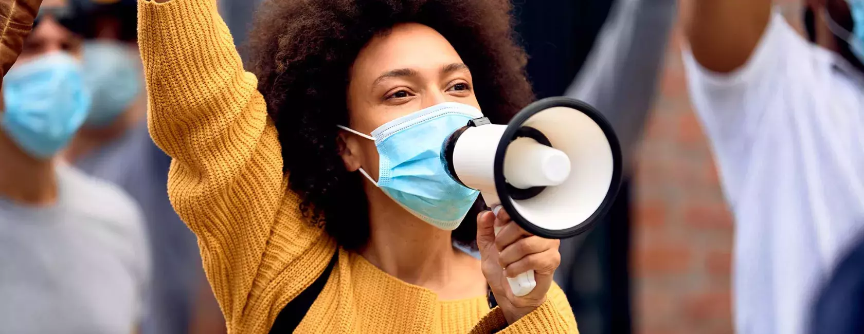 Black Female in Protest - Solo - Raised Fist - Wearing Mask