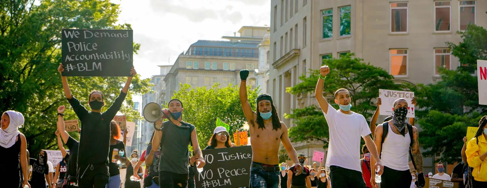 Group protest or march - raised fists - wearing face masks